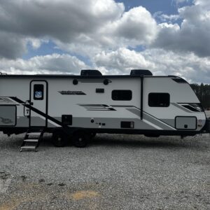 A sleek, modern 2025 Jayco Jay Feather 25RB travel trailer with a white exterior and gray graphics. The RV has a single slide-out, an extended power awning, and a durable, rounded front profile.