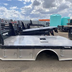 A Hillsboro STA500 Hybrid Truck Bed, a professional-grade flatbed with a mix of steel and aluminum components. The bed is black with a diamond-plate floor and a sturdy headache rack, and features a gooseneck ball and receiver hitch for towing.