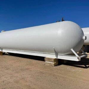 Large, dark-colored 18000-gallon skid tank sitting on a metal frame, or "skid," ready for transport or placement. The tank is cylindrical with a slight sheen and has visible valves and ports on top.